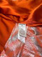 Traje de Adriana Iglesias de seda naranja y lurex