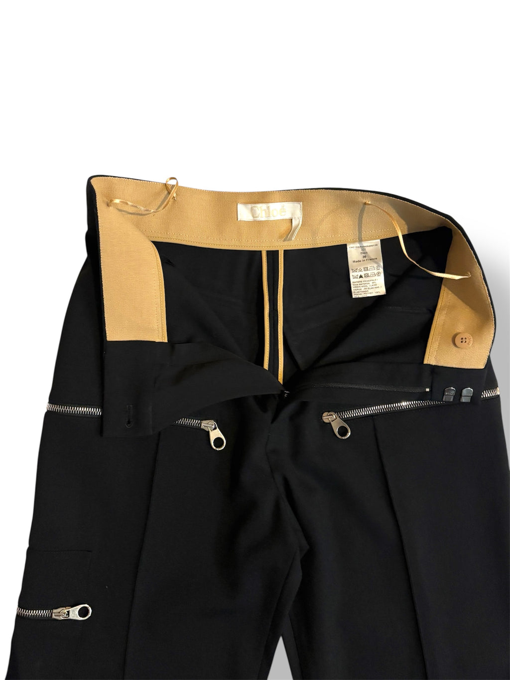Pantalón Chloé negro de tiro alto con pernera flare y cremalleras