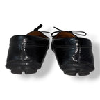 Mocasines Prada de Charol Negro con Lazo y Logotipo Metálico