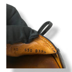 Mocasines Prada de Charol Negro con Lazo y Logotipo Metálico